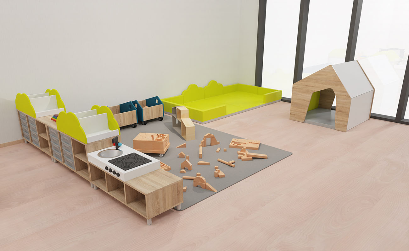 Gruppenraum Wohlfühlgruppenraum Ausschnitt mit Flexeo Raumtrennerregal, Regalaufsatz Bücherkiste Busch und Küche, Betzold Bausteinwagen, EduCasa Spielhaus und Krabbelebene